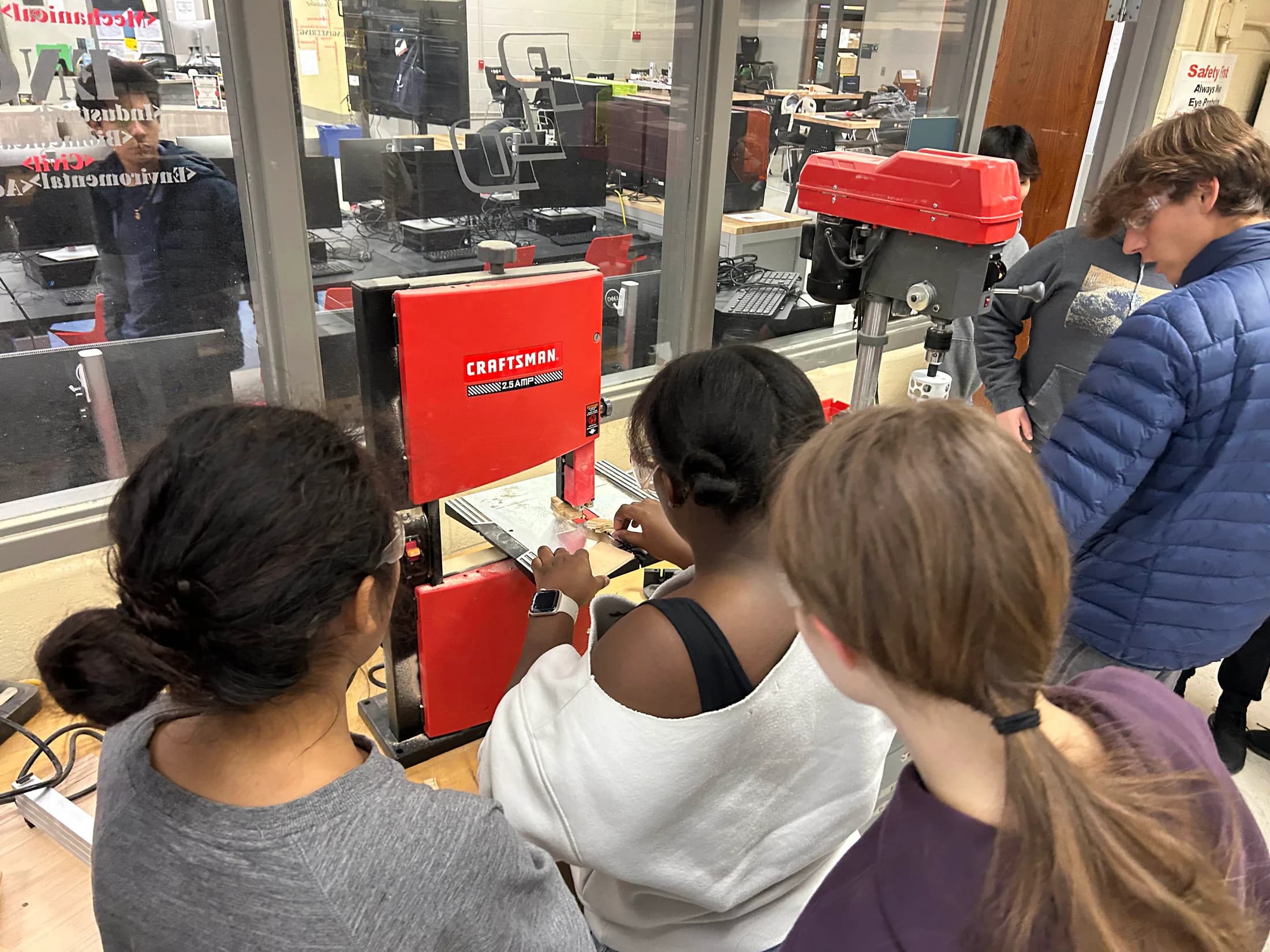 Planetary Drive students using workshop equipment to fabricate robot parts